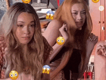 two women are standing next to each other and one has a surprised expression on her face