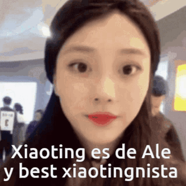 a close up of a woman 's face with the words " xiaoting es de ale y best xiaotingnista " below her