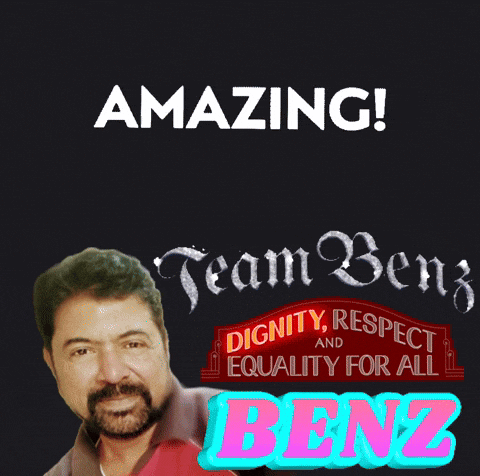 a man with a beard is standing in front of a sign that says amazing team benz dignity respect and equality for all benz