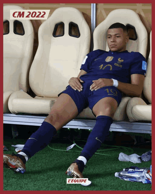 a soccer player with the number 10 on his jersey sits in a locker room