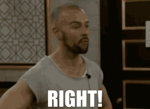 a man with a beard is standing in front of a door and saying right