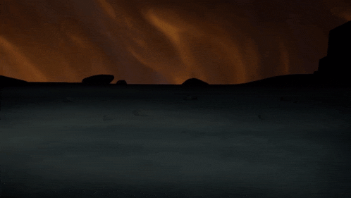 a silhouette of a person in a dark room with a fire in the background