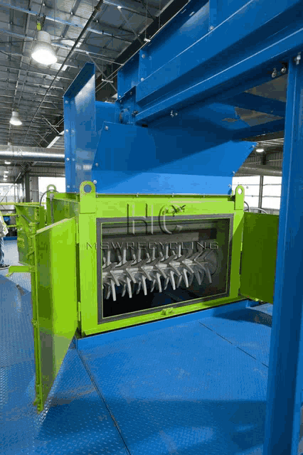 a green and blue machine that says nc on the top