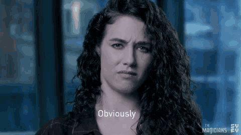 a woman with curly hair is making a funny face and the word obviously is on her face .