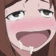 a close up of a girl 's face with her mouth open and her tongue hanging out .