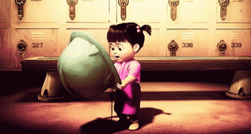 a little girl is standing in front of lockers that have the number 337 on them