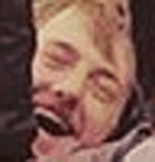 a close up of a person 's face with a mask on .
