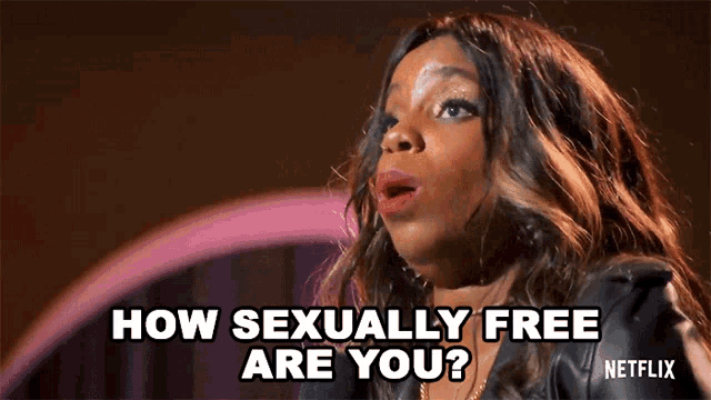 a woman is standing in front of a microphone and saying how sexually free are you .