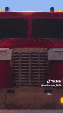 a red robot with a light coming out of its head