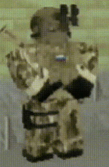 a pixelated image of a soldier with a flag on his chest .