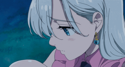 a close up of a girl 's face with blue eyes