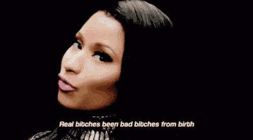 a close up of a woman 's face with the words `` real bitches been bad bitches from birth '' written on the bottom .