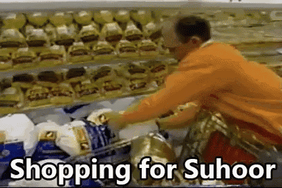 a man is pushing a shopping cart in a grocery store with the words shopping for suhoor above him