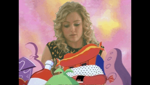 a woman is surrounded by a bunch of colorful objects including a house and a bottle