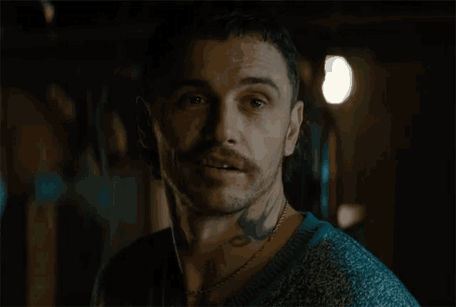 a man with a tattoo on his neck has the word oh on his face