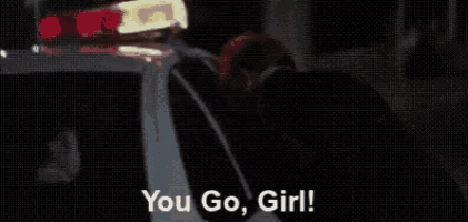 a police car with a light on top of it and the words `` you go girl '' written on it .