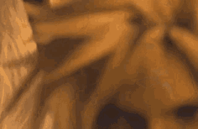 a close up of a blurred image of a person 's face