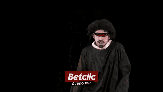 a man wearing sunglasses and a black shirt with the word betclic on it