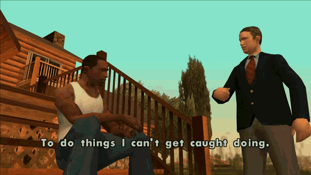 a man in a suit talks to another man who is sitting on a deck