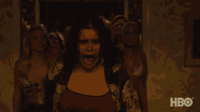 a group of women are dancing in a room with the hbo logo in the corner