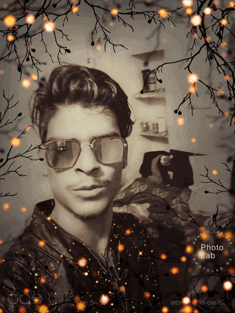 a man wearing sunglasses is surrounded by branches and a photo lab logo