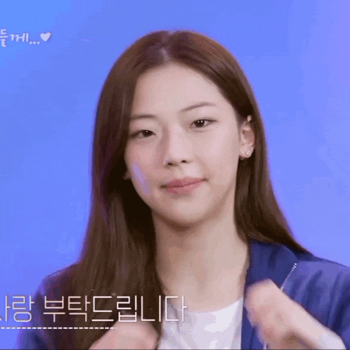 a close up of a woman 's face with korean writing on it