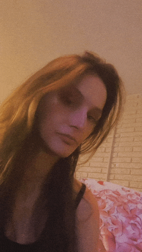 a woman 's face is shown in a blurry photo