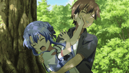 a boy and a girl are standing next to each other and the girl is holding the boy 's hand