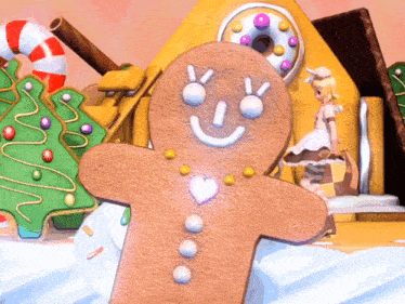 a gingerbread man with a smile on his face and a heart on his chest