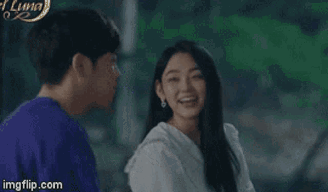 a man and a woman are looking at each other in a gif with imgflip.com at the bottom