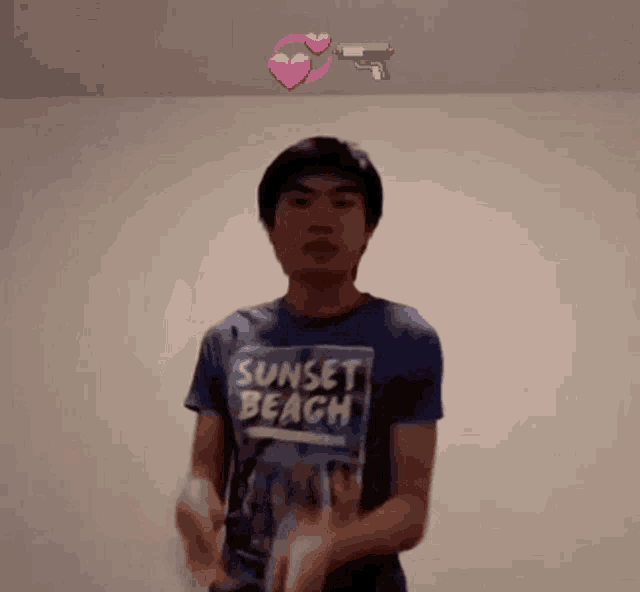 a man wearing a sunset beach t-shirt is dancing