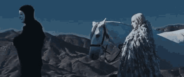 a man in a mask is standing next to a woman riding a horse .
