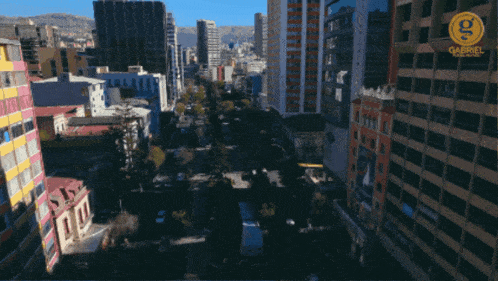 an aerial view of a city with the letter g on the top of a building