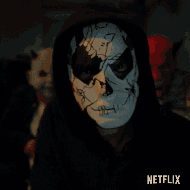 a person wearing a mask with a netflix logo behind them