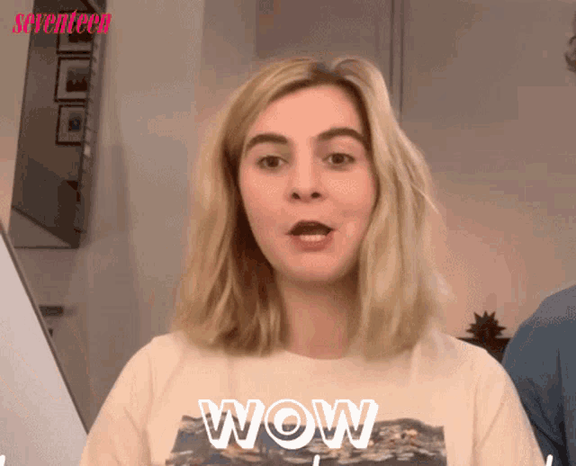 a woman wearing a t-shirt that says wow