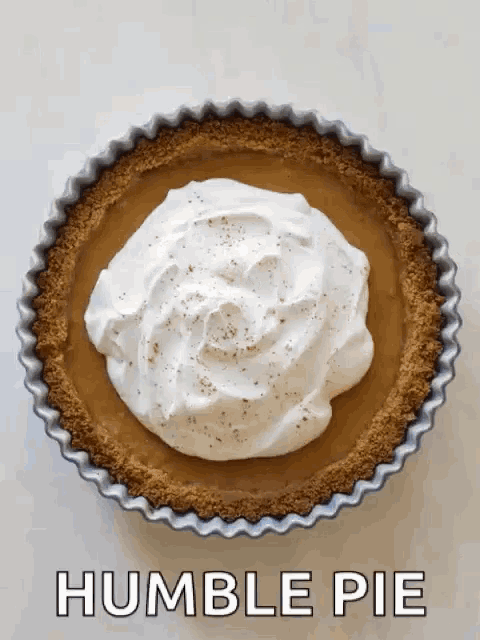 a humble pie with whipped cream on top and the words humble pie below it