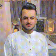 a man with a beard and mustache is wearing a white shirt and standing in a room .
