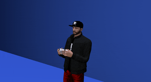 a man wearing a hat that says ' fox ' on it stands in front of a blue wall