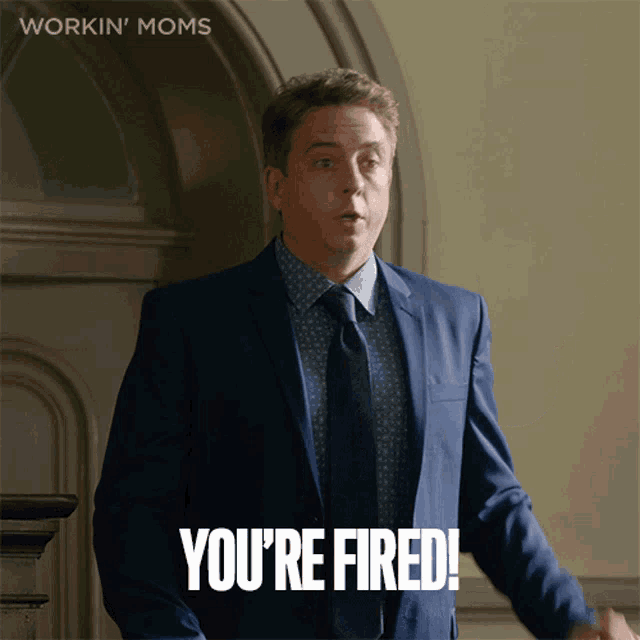 a man in a suit and tie is saying " you 're fired "
