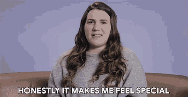 a woman is sitting on a couch with the words honestly it makes me feel special behind her