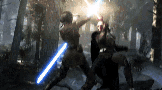 two people fighting with lightsabers in a forest