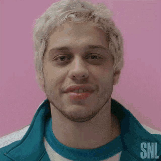 a close up of a man 's face with snl written on the bottom right