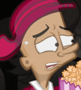 a cartoon character is eating popcorn and making a funny face