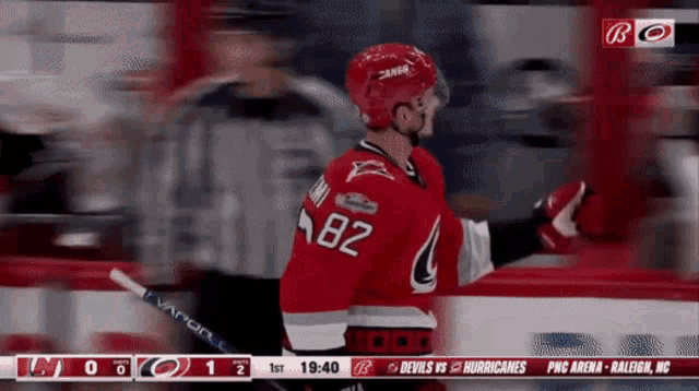 a hockey player with the number 82 on his shirt