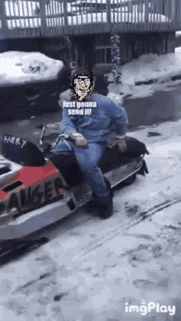 a man is sitting on a snowmobile with the words just gonna send it written on it