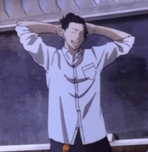 a man in a white shirt is standing in front of a blackboard with his hands behind his head .