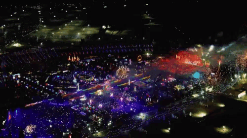 an aerial view of a fireworks display at night with a rainbow of colors