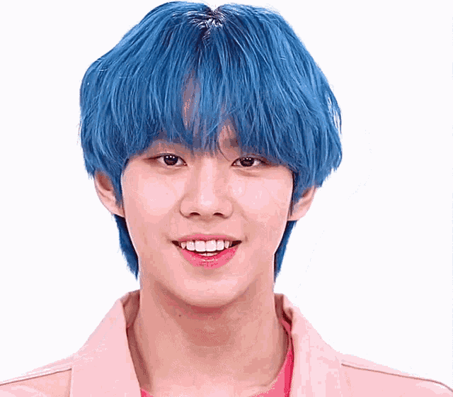 a young man with blue hair is wearing a pink shirt