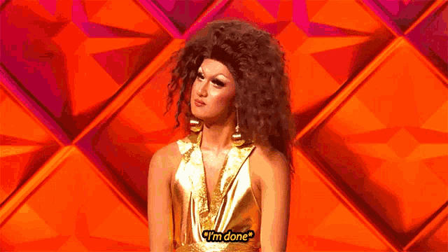 a drag queen says i 'm done in front of an orange background