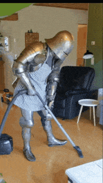 a person in armor is using a vacuum cleaner